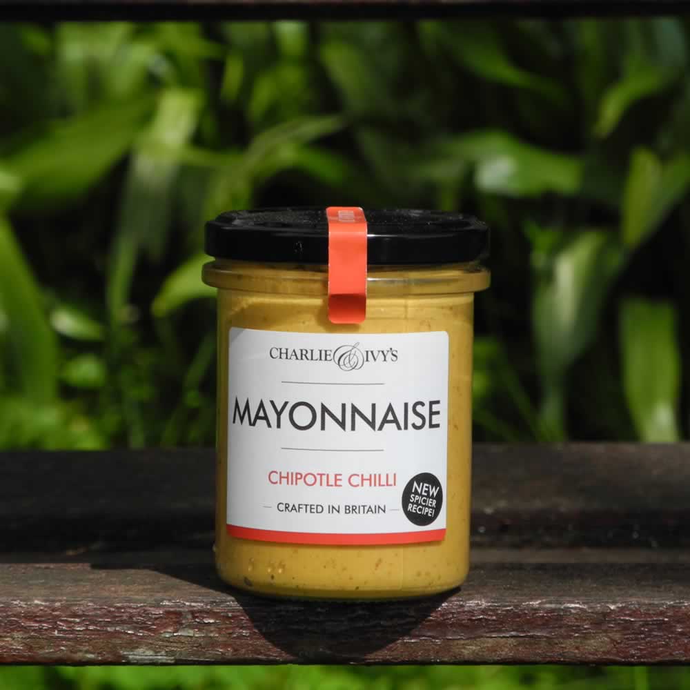 Charlie & Ivy's Chipotle Chilli Mayonnaise on wooden bench with plant background