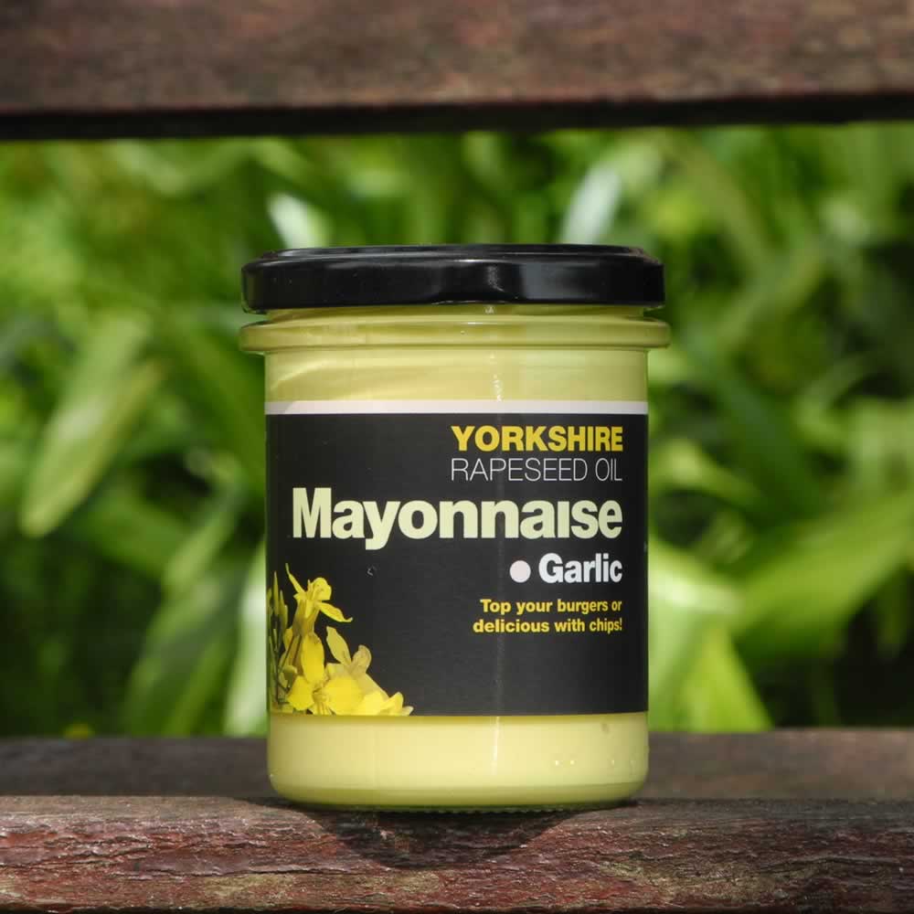 Yorkshire Rapeseed Oil Garlic Mayonnaise on wooden bench with plant background